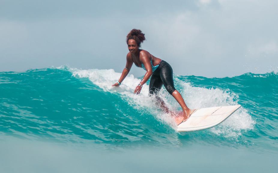 Woman Surfing on Longboard